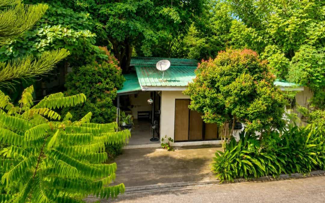 Just Like Home with a green roof surrounded by trees in Davao City