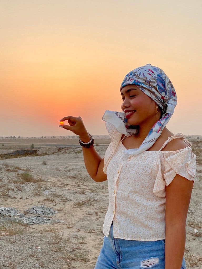 Dopegine smiling in the desert at sunset